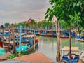 Jetty scenery with fishing boats anchored in Parit Jawa, Muar, Johor, Malaysia