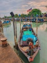 Jetty scenery with fishing boats anchored in Parit Jawa, Muar, Johor, Malaysia