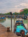 Jetty scenery with fishing boats anchored in Parit Jawa, Muar, Johor, Malaysia