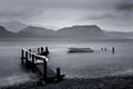 Jetty by stormy lake Royalty Free Stock Photo