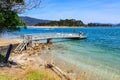 Jetty at the sunny coastal town of Tairua, New Zealand Royalty Free Stock Photo