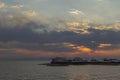 Several boats are on sight in the sea at sunset cloudy sky Royalty Free Stock Photo