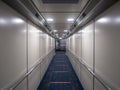 Jetway, walking towards the plane on carpet, seeing the plane door. perspective aerobridge corridor to aircraft. Royalty Free Stock Photo