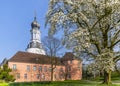 Jever Castle Museum and magnolia blossom in spring, Germany