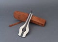 Jew`s harp with wooden case on grey background. Royalty Free Stock Photo