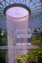 Jewel Changi Airport rain vortex waterfall with canopy suspension bridge, Singapore.