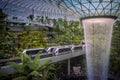 Jewel Changi Airport Skytrain running along rain vortex waterfall, Singapore. Royalty Free Stock Photo