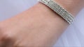 Jeweler bracelet on the bride`s hand. Bride`s hands with ring. Wedding. Wedding day. Luxury bracelet on the bride`s hand