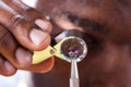 Jeweler Examining Diamond Through Loupe Royalty Free Stock Photo