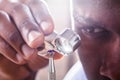 Jeweler Examining Diamond Through Loupe Royalty Free Stock Photo