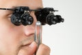 Jeweler Examining Diamond With Magnifying Loupe Royalty Free Stock Photo