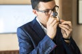 Jeweler examining diamond through loupe Royalty Free Stock Photo