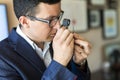 Jeweler looking at diamond through loupe Royalty Free Stock Photo