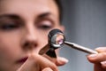 Jeweler Looking At Diamond Through Magnifying Loupe Royalty Free Stock Photo