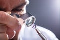 Jeweler Looking At Diamond Through Magnifying Loupe Royalty Free Stock Photo