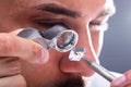 Jeweler Looking At Diamond Through Magnifying Loupe Royalty Free Stock Photo