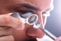 Jeweler Looking At Diamond Through Magnifying Loupe Royalty Free Stock Photo