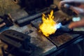 Jeweler melting gold