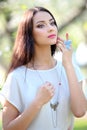 Jeweler necklace with finger ring on the beautiful woman model. Royalty Free Stock Photo