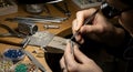 Jeweler meticulously crafting filigree ring with precision tools and gems Royalty Free Stock Photo