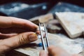 Jeweler setting a precious stone with pincers on a ring Royalty Free Stock Photo