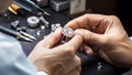Jeweler working on a diamond ring in a jewelery shop