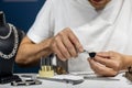 A jeweler is working on a ring in a workshop Royalty Free Stock Photo