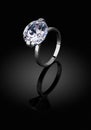 Jewelery ring with big diamond on black background, clipping pat