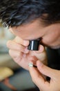 Jeweller appraising a ring