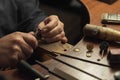 Jeweller manually polishing golden ring Royalty Free Stock Photo