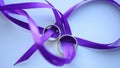 Gold Wedding Rings On the purple ribbon macro closeup shoot diamon Jewellery