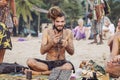 Jewelry artist selling his art at Kudli beach, Gokarna, Karnataka, India