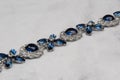 jewelry with blue saphire. Necklace or bracelet with cubic zirconia, diamonds and topaz.Sapphire, Blue Diamond. Closeup