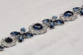 jewelry with blue saphire. Necklace or bracelet with cubic zirconia, diamonds and topaz.Sapphire, Blue Diamond. Closeup