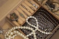 Jewelry box with different rings, earrings and pendants with pearls. Royalty Free Stock Photo