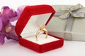 Jewelry box with ring, flower background Royalty Free Stock Photo