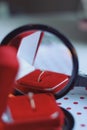 Jewelry composition in red box with reflections in mirror