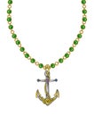 Jewelry design art anchor set with green sapphire necklace. Royalty Free Stock Photo