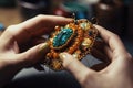 a jewelry designer and beadwork on a brooch