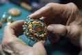 a jewelry designer and beadwork on a brooch