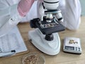 Jewelry examination at a workstation with a microscope and tools for analysis in a laboratory Royalty Free Stock Photo