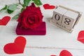 Jewelry gift box with  and bautiful red roses on wooden background. Greeting card for the 8th of March Royalty Free Stock Photo