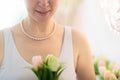 Jewelry gift. Pearl necklace on woman with flowers Royalty Free Stock Photo