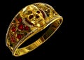 Jewelry gold skull ring with diamond and red ruby gems.