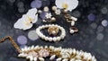 Jewelry gold white pearl set for woman and girl necklace earrings bracelet earring rings on black gold silver backgroun