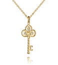 Jewelry golden pendant with diamonds, key, golden chain, yellow gold, isolated on white