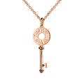 Jewelry golden pendant with diamonds, key with watch marks, golden chain, rose gold, isolated on white Royalty Free Stock Photo