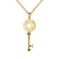 Jewelry golden pendant with diamonds, key with watch marks, golden chain, yellow gold, isolated on white