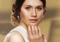 Close up of beautiful woman wearing shiny diamond earrings Royalty Free Stock Photo