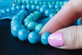 Jewelry made of turquoise on a woman`s hand